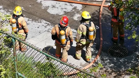 Firefighters filmed from high ground Stock Footage 90337087