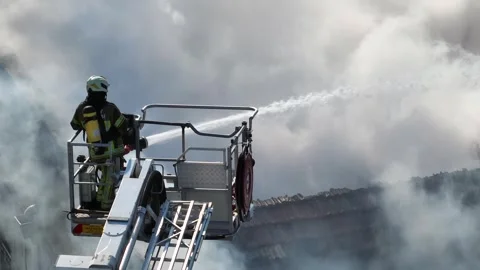 Firefighters on the fire escape responding to a burn - Stock-Footage 292759866