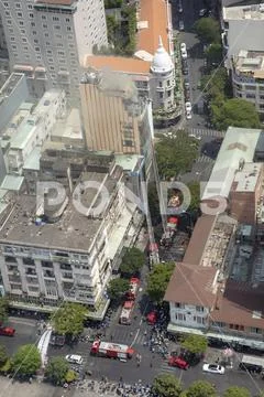 Firefighters at fire on high rise building in Ho Chi Minh City Vietnam Stock Photos