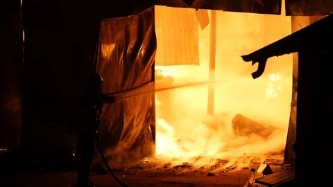 Firefighters In Front Of A Burning Warehouse Stock Footage 91329506