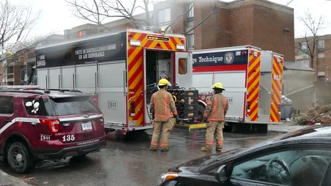 Firefighters getting oxygen tank out of the truck Stock Footage 139664336