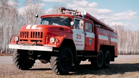 Firefighters go to the car after the extinguished fire.Fire engine Stock Footage 172070600