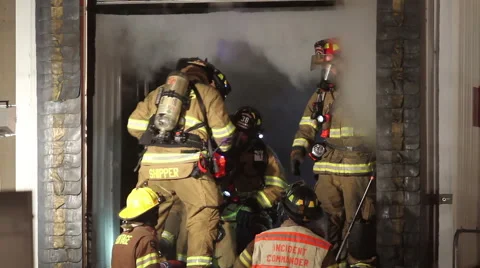 Firefighters Going inside Burning Building Video stock 45654779