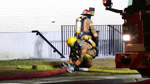Firefighters having hard time with hoses Stock Footage 114743149