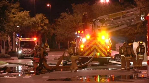 Firefighters with hose 2 Stock Footage 688568