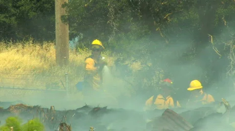 Firefighters Hose Down Fire Stock Footage 562726