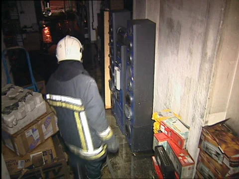 Firefighters inside burning warehouse Stock Footage 655462