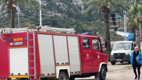 Firefighters Installing Christmas Lights with Red Fire Truck in Kotor Old Stock Footage 322118435