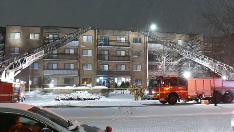 Firefighters intervention during apartment buidling Stock Footage 125422366