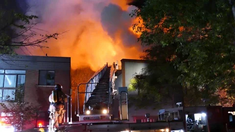 Firefighters on ladder with flames Stock Footage 116122159