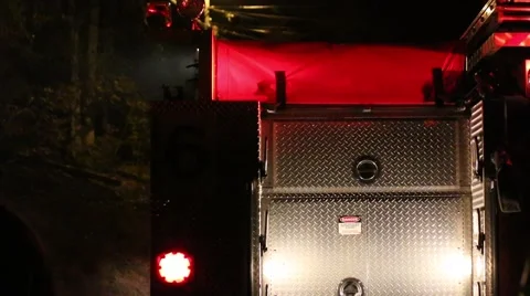 Firefighters Leave Engine with Lights Flashing Stock Footage 43494245