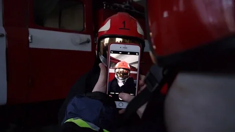 Firefighters make selfie on smartphone Stock Footage 72428156