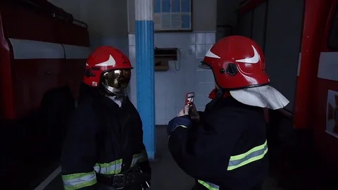 Firefighters make selfie on smartphone Stock Footage 72428170
