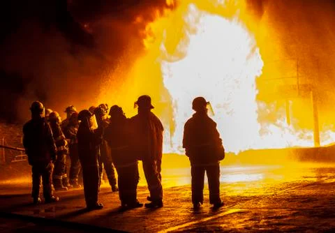 Firefighters observing structural fire Stock Photos