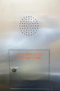 Firefighters operation control panel on brushed stainless steel wall Stock Photos