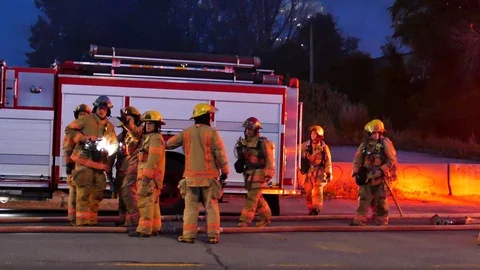 Firefighters organisating during fire Stock Footage 115967629
