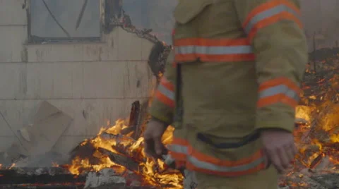 Firefighters pass by house fire Stock Footage 61180693