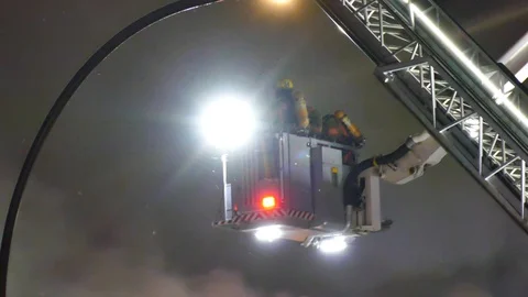 Firefighters in platform with smoke Stock Footage 116009874