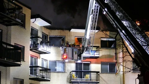 FIrefighters on platform working on flames Stock Footage 114751176