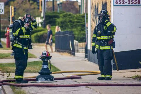 Firefighters preparing hose Stock Photos