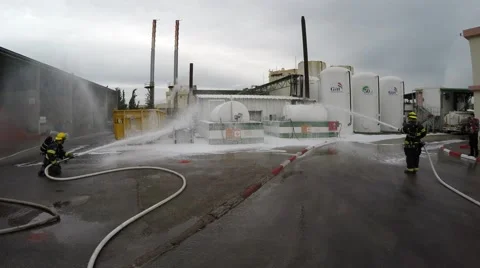Firefighters with protective gear practice leak of Ammonia chemical Stock Footage 50120914