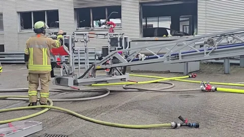Firefighters in protective gear at a training ground. Stock Footage 331396244