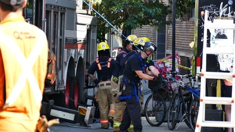 Firefighters pulling rope ton help victim during intervention Stock Footage 115966700