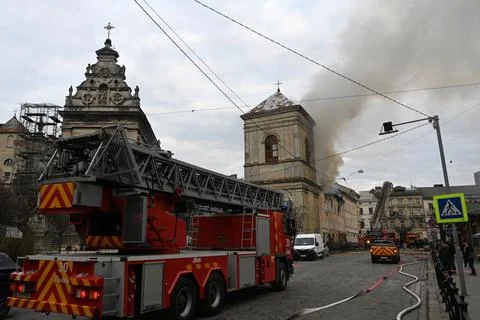 Firefighters put out the fire in a building following a Russian drone attack Stock Photos