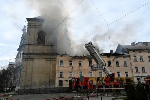 Firefighters put out the fire in a building following a Russian drone attack Stock Photos