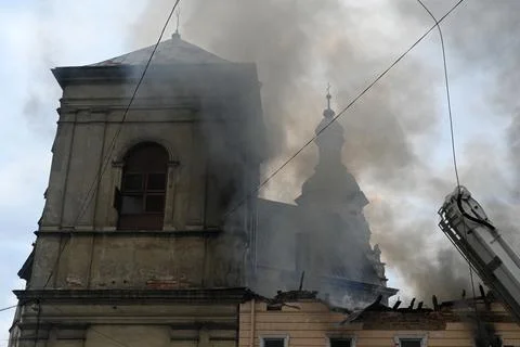 Firefighters put out the fire in a building. Stock Photos