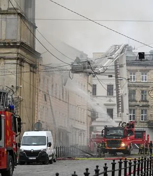 Firefighters put out the fire in a building. Stock Photos