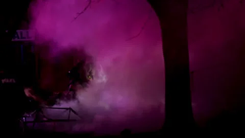 Firefighters putting out fire at night. Stock Footage 297499691