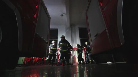 Firefighters quickly put on fire suits at night, Beijing, China Stock Footage 143002911
