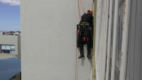 Firefighters rappelling from school building save children after rocket attack Видео 135361105