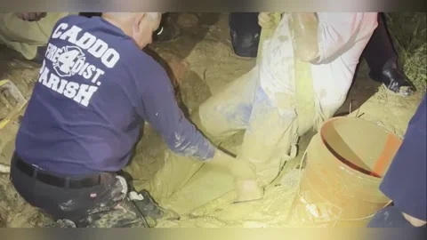 Firefighters Rescue Man Trapped in Thick Mud in Caddo Parish, USA Stock Footage 280570175