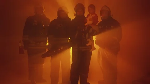 Firefighters with rescued child Stock Footage 88041765
