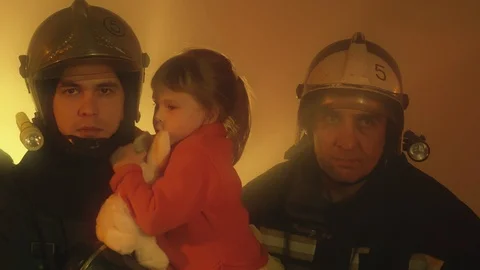 Firefighters with rescued child Stock Footage 88041904