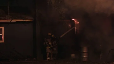 Firefighters in Residential Fire Stock Footage 70020222