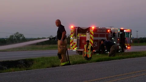 Firefighters responding to fire on road. Stock Footage 109687458
