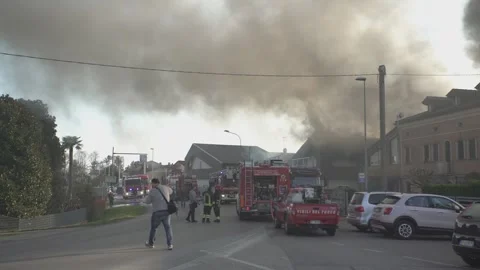 Firefighters responding to residential house fire emergency scene Stock Footage 296737854
