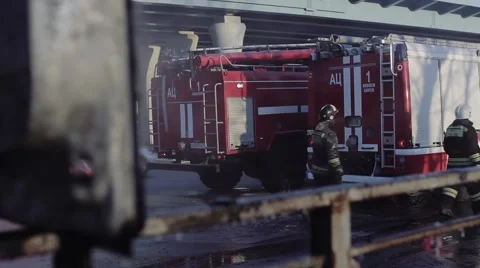 Firefighters on the roadway after fire Stock Footage 59828236