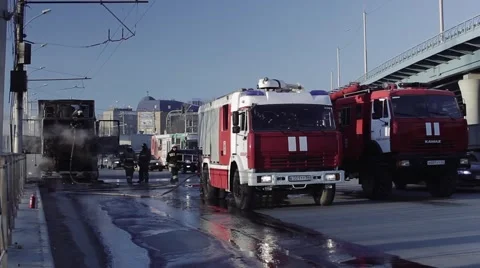 Firefighters on the roadway after fire Stock Footage 59828265