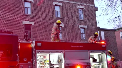 Firefighters on the rood of firepump Stock Footage 139664285