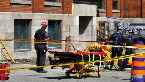 Firefighters saving fallen worker Stock Footage 115968132
