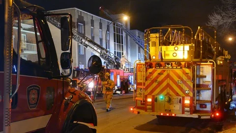 Firefighters at scene of extinguish fire Stock Footage 103623708