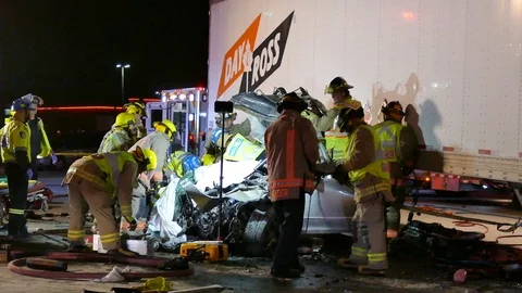 Firefighters Setting Up Pulley System At Car Crash - 24fps 1080p Stock Footage 91563636