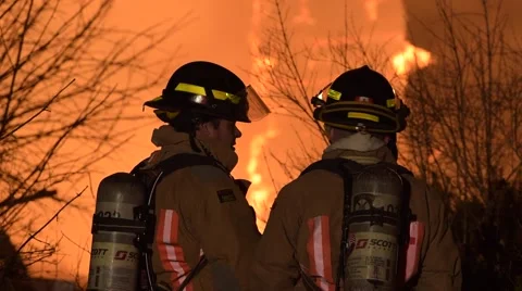 Firefighters Silhouetted in Fire Stock Footage 59868111