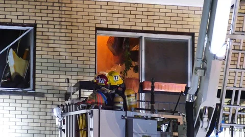 Firefighters splashing flames Stock Footage 114751768
