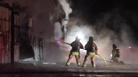 Firefighters Spray Water at Barn Fire 스톡 동영상 59902615