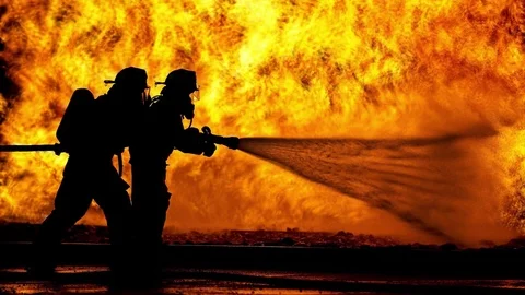 Firefighters spray wildfire cinemagraph plotagraph Stock Footage 87491744